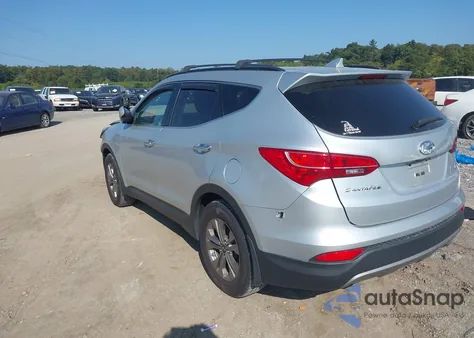 2015 Hyundai Santa Fe Sport 2.4L z USA, uszkodzony, nr VIN 5XYZUDLB7FG277165